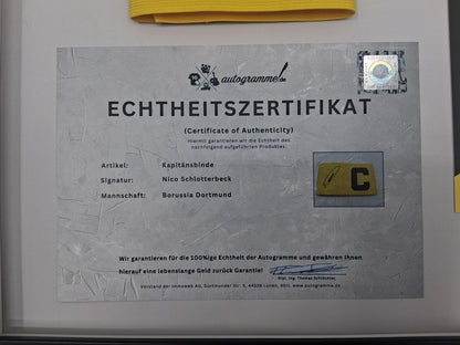 Captain's armband signed by Nico Schlotterbeck in a Germany COA frame