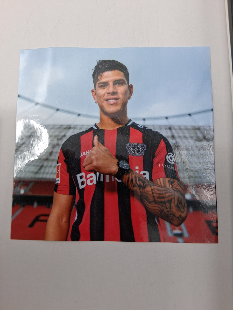 Captain's armband signed by Piero Hincapié in a frame, autographed by Bayer 04 Leverkusen