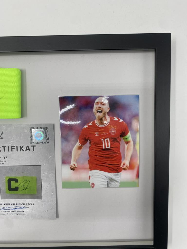 Captain's armband signed by Christian Eriksen in a frame Denmark Autograph