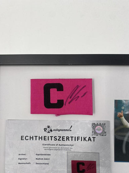 Captain's armband signed by Nadiem Amiri in a Germany-themed autograph frame