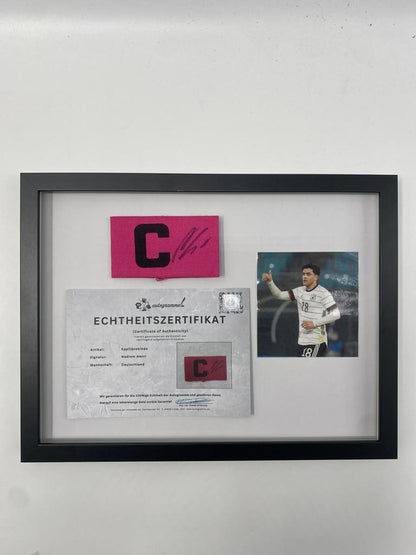 Captain's armband signed by Nadiem Amiri in a Germany-themed autograph frame