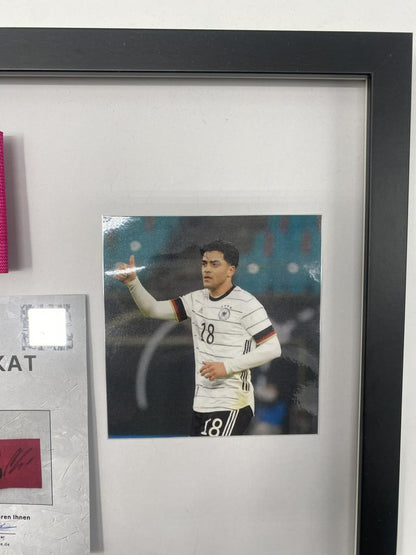 Captain's armband signed by Nadiem Amiri in a Germany-themed autograph frame