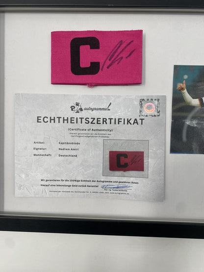 Captain's armband signed by Nadiem Amiri in a Germany-themed autograph frame