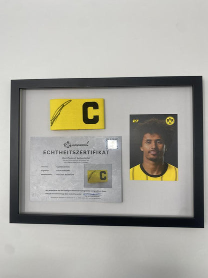 Captain's armband signed by Karim Adeyemi in a Borussia Dortmund autograph COA frame