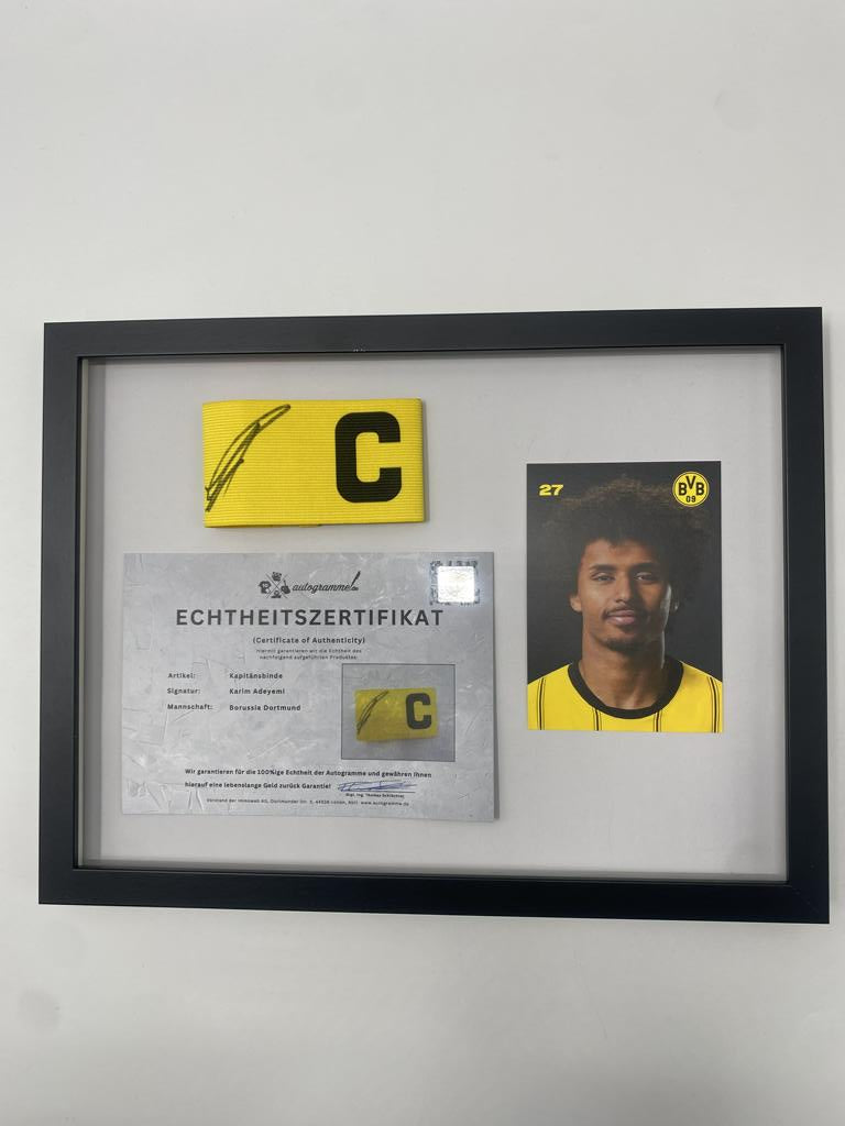 Captain's armband signed by Karim Adeyemi in a Borussia Dortmund autograph COA frame