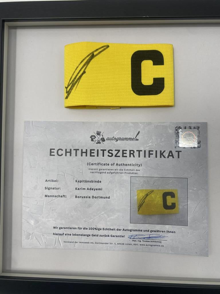 Captain's armband signed by Karim Adeyemi in a Borussia Dortmund autograph COA frame