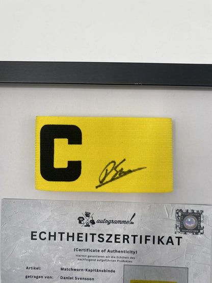 Captain's armband signed by Daniel Svensson as part of the Borussia Dortmund COA