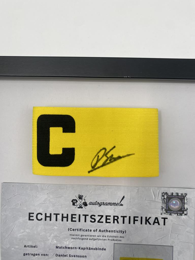 Captain's armband signed by Daniel Svensson as part of the Borussia Dortmund COA