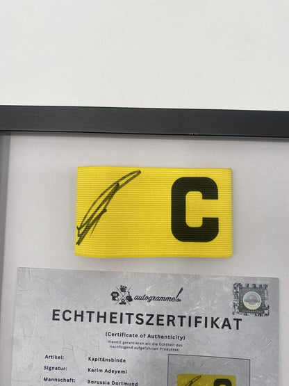 Captain's armband signed by Karim Adeyemi in a Borussia Dortmund autograph COA frame