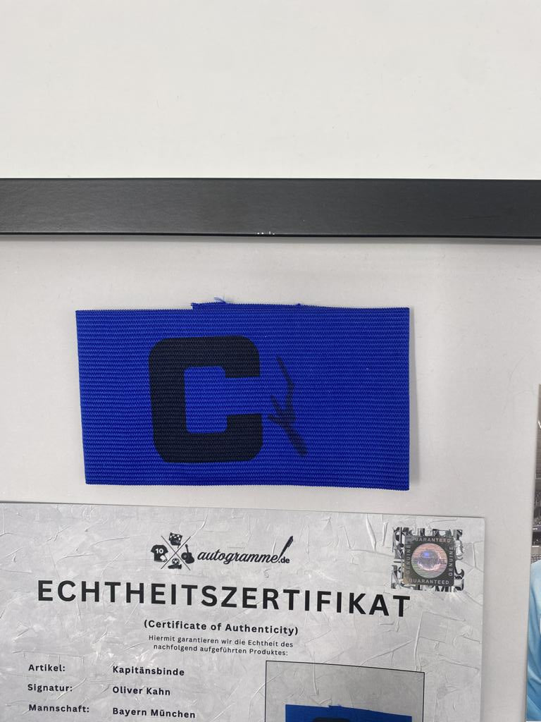 Captain's armband signed by Oliver Kahn in a Bayern Munich autograph COA frame