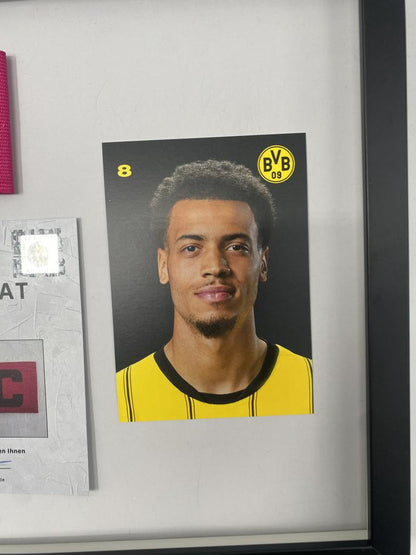 Captain's armband signed by Felix Nmecha as part of the Borussia Dortmund COA