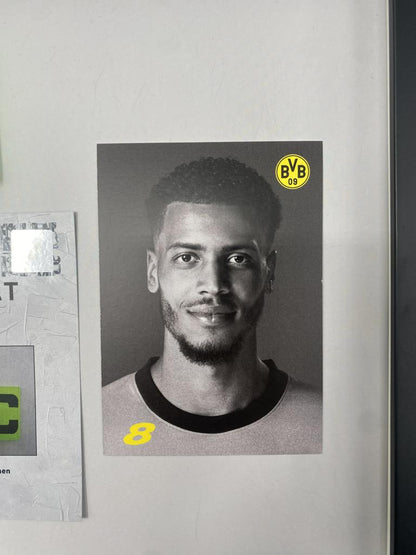 Captain's armband signed by Felix Nmecha as part of the Borussia Dortmund COA