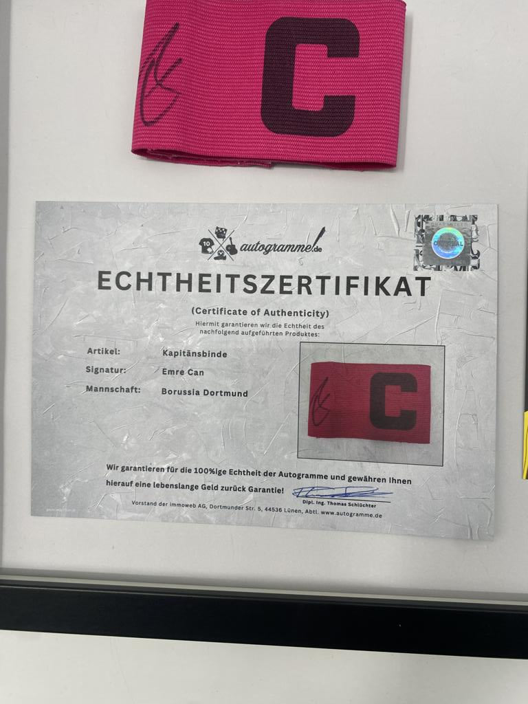 Captain's armband signed by Emre Can in a Borussia Dortmund COA frame